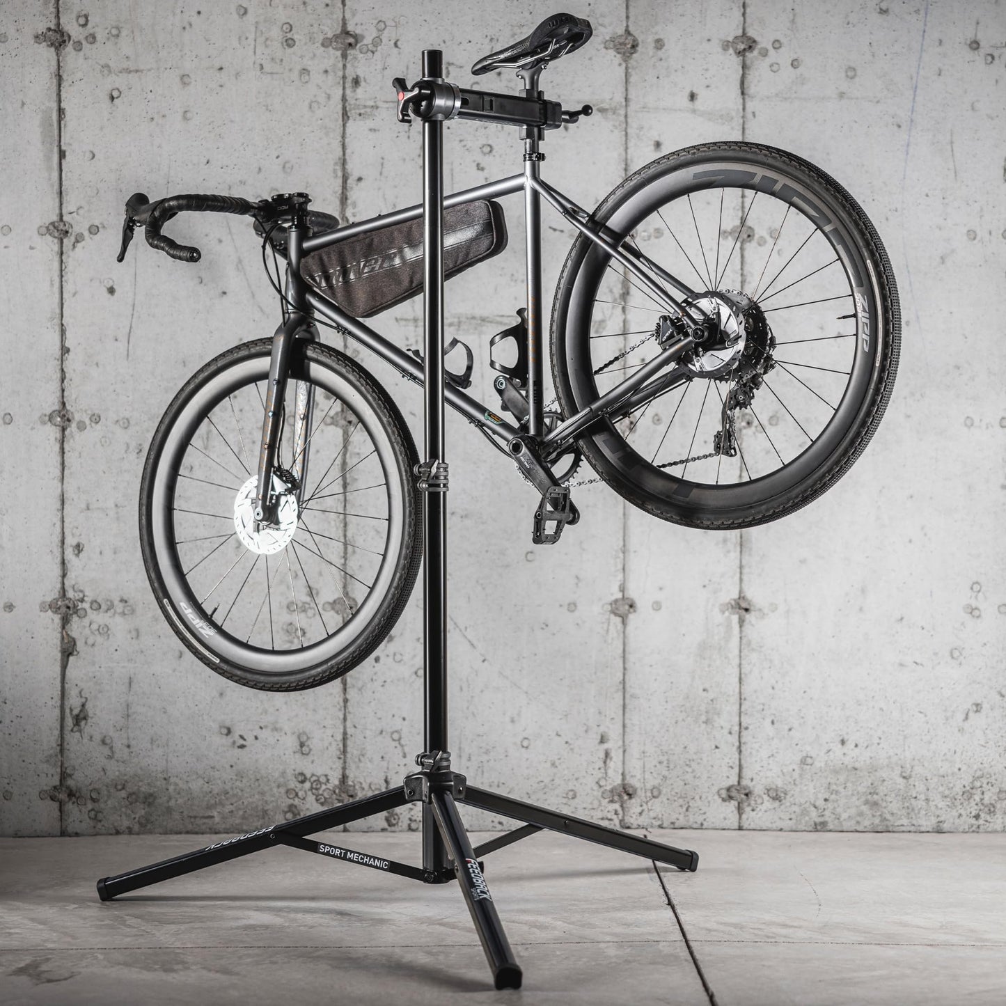 Feedback Sports | Sport-Mechanic Bicycle Repair Stand | Bicycle Workstand W/Tripod Base | Lightweight and Durable | Aluminum Steel Hybrid Construction | Black (Black, Sport Mechanic)